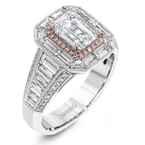 This lovely 18k white and rose gold ring has a graduated design which leads up to a rectangular center stone setting. The ring contains .18 ctw of round diamonds, .07 ctw of pink diamonds, and 1.48 ctw of baguette diamonds.
