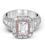 This lovely 18k white and rose gold ring has a graduated design which leads up to a rectangular center stone setting. The ring contains .18 ctw of round diamonds, .07 ctw of pink diamonds, and 1.48 ctw of baguette diamonds.