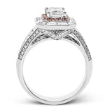 This lovely 18k white and rose gold ring has a graduated design which leads up to a rectangular center stone setting. The ring contains .18 ctw of round diamonds, .07 ctw of pink diamonds, and 1.48 ctw of baguette diamonds.