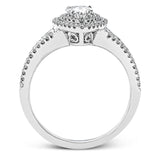 Featuring a pear-shaped double halo, this modern white gold engagement ring is highlighted by .68 ctw of round cut white diamonds.