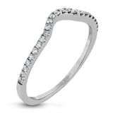 Featuring a pear-shaped double halo, this modern white gold engagement ring is highlighted by .68 ctw of round cut white diamonds.