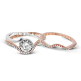 This modern wedding set is a bold choice with a crisscrossing design of 18k white and rose gold set with .26 ctw of white diamonds.