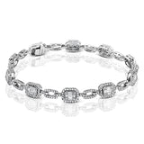 This gorgeous bracelet incorporates 2.07 ctw of round diamonds and 1.25 ctw of baguette diamonds into Mosaic designs which give a lovely, vintage appeal to this 18k white gold piece.