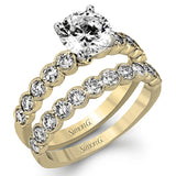 This engagement and wedding band set combines old and new with 1.09 ctw of round brilliant diamonds bezel set into 18k white gold, accented with vintage-inspired milgrain.