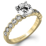 This engagement and wedding band set combines old and new with 1.09 ctw of round brilliant diamonds bezel set into 18k white gold, accented with vintage-inspired milgrain.