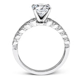 This engagement and wedding band set combines old and new with 1.09 ctw of round brilliant diamonds bezel set into 18k white gold, accented with vintage-inspired milgrain.