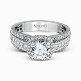 Featuring an impressive halo, this contemporary white gold engagement ring is accented by .22 ctw of round cut white diamonds and .42 ctw princess cut diamonds.