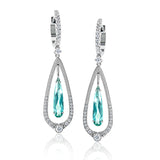 These gorgeous 18k white gold and diamond earrings recall the elegance of yesteryear with an teardrop design set with 2.83 ctw of green tourmalines in their midst.