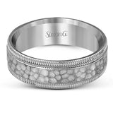This stunning contemporary platinum men's wedding band features a hammered center column outlined dual milgrain edges for an eye-catching design.