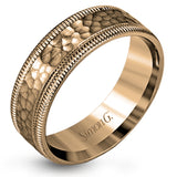 This stunning contemporary platinum men's wedding band features a hammered center column outlined dual milgrain edges for an eye-catching design.
