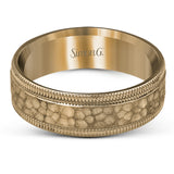 This stunning contemporary platinum men's wedding band features a hammered center column outlined dual milgrain edges for an eye-catching design.