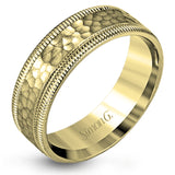 This stunning contemporary platinum men's wedding band features a hammered center column outlined dual milgrain edges for an eye-catching design.