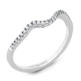 This distinctive, swirling ring design is set with .19 ctw and holds the center stone in a partial bezel setting.