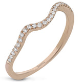 This distinctive, swirling ring design is set with .19 ctw and holds the center stone in a partial bezel setting.