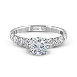 Simple yet dazzling, this white gold engagement ring features .89 ctw of round white diamonds set into the shank.