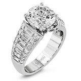This significant engagement ring is sure to make a statement with 1.13 baguette diamond side stones outlined my .98 ctw of princess cut diamonds.
