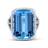 This remarkable 18k white gold ring features a beautiful 15.48 ct aquamarine stone in the center.