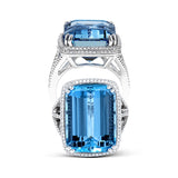 This remarkable 18k white gold ring features a beautiful 15.48 ct aquamarine stone in the center.