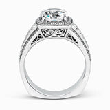 This romantic white gold contemporary ring is accentuated by .25 ctw of glistening round cut white diamonds and .94 ctw of princess cut diamonds.