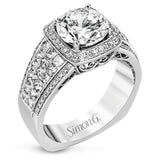 This romantic white gold contemporary ring is accentuated by .25 ctw of glistening round cut white diamonds and .94 ctw of princess cut diamonds.