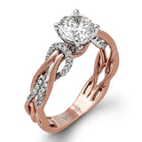 This impressive contemporary two-tone engagement ring features a unique twisting design on the shank, which is complemented by .17 ctw of round cut white diamonds.