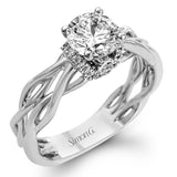 The distinctive twist design on the shank of this two-tone ring sets the stage for a sparkling setting of .13 ctw of round cut white diamonds.
