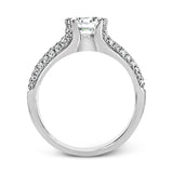 A modern take on a classic design, this white gold engagement ring is accented by .35 ctw of round cut white diamonds.