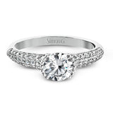 A modern take on a classic design, this white gold engagement ring is accented by .35 ctw of round cut white diamonds.