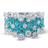 Presenting a dazzling contemporary design, this white gold ring is set with 2.96 ctw of stunning white diamonds and 1.43 ctw eye-catching Paraiba tourmaline stones.