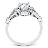 Accentuated with an impressive halo design, this contemporary white gold ring features .21 ctw round cut white diamonds.