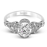 Accentuated with an impressive halo design, this contemporary white gold ring features .21 ctw round cut white diamonds.
