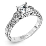 Featuring a dazzling vintage design, this romantic white gold engagement ring is highlighted by .15 ctw of striking white diamonds.