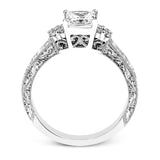 Featuring a dazzling vintage design, this romantic white gold engagement ring is highlighted by .15 ctw of striking white diamonds.