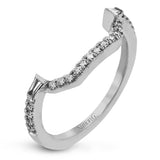 Reflecting an eye-catching modern design, this white gold engagement ring is emphasized by .39 ctw of round white diamonds and .64 ctw baguette cut white diamonds.