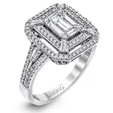 Reflecting an eye-catching modern design, this white gold engagement ring is emphasized by .39 ctw of round white diamonds and .64 ctw baguette cut white diamonds.