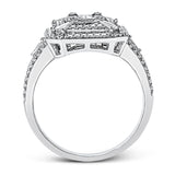 Reflecting an eye-catching modern design, this white gold engagement ring is emphasized by .39 ctw of round white diamonds and .64 ctw baguette cut white diamonds.