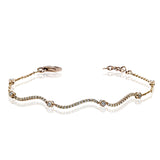 This curving gold bracelet is incredibly comfortable to wear due to its flexible design that sparkles with .50 ctw of white diamonds.