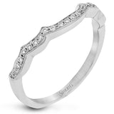 The lovely vintage design of this impressive white gold ring is emphasized by .27 ctw sparkling round cut white diamonds.