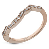 The lovely vintage design of this impressive white gold ring is emphasized by .27 ctw sparkling round cut white diamonds.