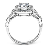 The lovely vintage design of this impressive white gold ring is emphasized by .27 ctw sparkling round cut white diamonds.