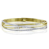 Featuring a distinctive contemporary design, this twist style bracelet is accentuated with 1.51 ctw of shimmering white diamonds in a dazzling white and rose gold setting.
