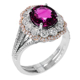 This stunning 18k rose and white gold ring features an exquisite 3.28 ct reddish-pink spinel center stone surrounded by 1.35 ctw of white diamonds.