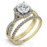 Presenting a lovely twisted shank design, this contemporary white gold engagement ring and wedding band set is accentuated with .44 ctw round cut white diamonds.