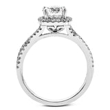 Presenting a lovely twisted shank design, this contemporary white gold engagement ring and wedding band set is accentuated with .44 ctw round cut white diamonds.