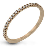 Presenting a lovely twisted shank design, this contemporary white gold engagement ring and wedding band set is accentuated with .44 ctw round cut white diamonds.