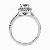 Presenting a lovely twisted shank design, this contemporary white gold engagement ring and wedding band set is accentuated with .44 ctw round cut white diamonds.