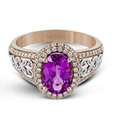 18KWR right hand ring with an intricate design along the shank has a diam halo .55 ctw, and an oval KNZT 5.89 ctw.