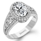 18KWR right hand ring with an intricate design along the shank has a diam halo .55 ctw, and an oval KNZT 5.89 ctw.