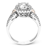 The delicate romantic design of this vintage inspired white and rose gold engagement ring and wedding band set is accentuated by .45 ctw of white diamonds and .08 ctw of pink diamonds.