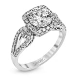 The delicate romantic design of this vintage inspired white and rose gold engagement ring and wedding band set is accentuated by .45 ctw of white diamonds and .08 ctw of pink diamonds.
